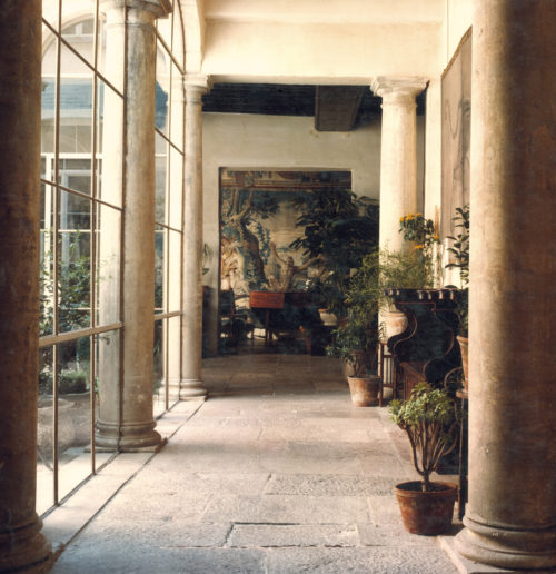 Interior view of room in the Vlaeykensgang with a central passage leading to a tapestry