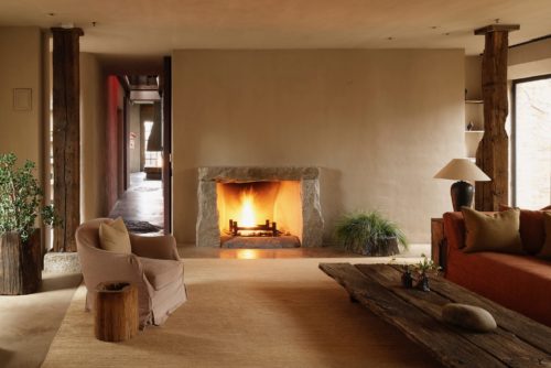 A stone fireplace offers warmth and atmosphere in a sitting room in TriBeCa