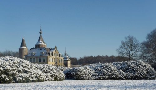 The snow-covered park in winter on the grounds of the Castle of 's-Gravenwezel